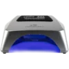 The Gel II Cordless Lamp 7D Diamond Edition is a silver LED nail lamp with a black label on top, emitting blue light from underneath. This rechargeable device brings professional-level quality to your manicures.