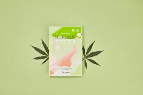 An AvryBeauty CBD Gloves Single package with a cannabis leaf on top.