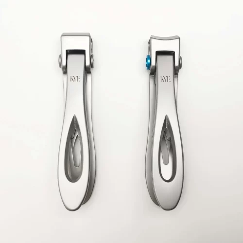 A pair of KYE Wide Jaw Toe Nail Clippers on a white surface.