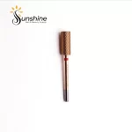 Sentence with Product Name: Gold-toned KYE Premium Bit Small Barrel 5.35mm nail drill bit on a white background with "sunshine nails & beauty supply" logo above.