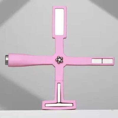 Pink multifunctional Cat Eye Magnet Stick with multiple ports in a cross shape.