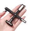 A hand holding a Multifunctional Cat Eye Magnet Stick with multiple socket heads.