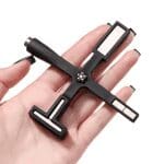 A hand holding a Multifunctional Cat Eye Magnet Stick with multiple socket heads.