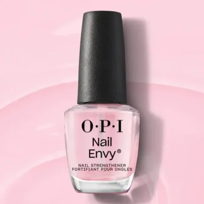 Bottle of OPI Nail Envy Tri-Flex Technology 0.5oz on a pink background.