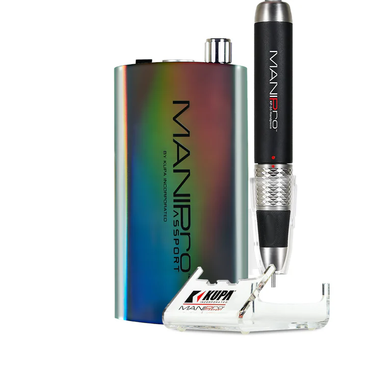 Image of the ManiPro Passport Limited Edition Moonlight Unicorn portable electric nail drill featuring a rainbow-colored control box, a black handpiece, and a clear acrylic handpiece holder. The brand "Kupa" is prominently displayed on both the device and the holder. This device's vibrant finish evokes the playful spirit of the Moonlight Unicorn.