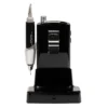 The ManiPro Passport Next Complete Black is a precision tool with a sleek silver finish, accompanied by a cord and mounted on an elegant black charging stand.