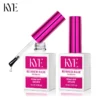 Two bottles of KYE Rubber Base 0.5oz (NO HEMA) nail polish, each featuring pink caps. One of the bottles shows a brush coated with the "No HEMA" formula. The packaging indicates "Soak Off UV/LED.