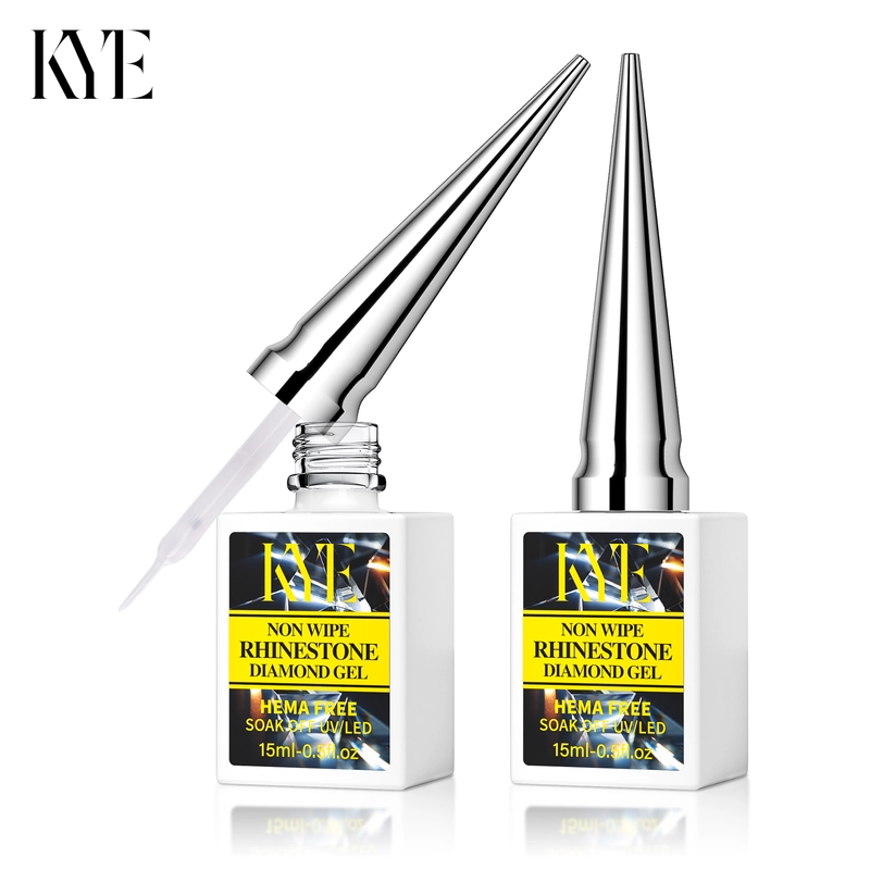 Two bottles of KYE Non Wipe Rhinestone Diamond Gel and KYE Rubber Base 0.5oz (NO HEMA), each featuring a shiny silver pointed cap, offer a 15ml (0.5 fl oz) capacity. The NO HEMA formula guarantees safety and quality in every application.