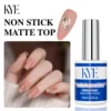 A bottle of KYE Gel Non-Stick Matte Top 0.5oz (HEMA FREE) stands beside a hand with pink matte manicured nails, offering a safe, stunning, long-lasting look.